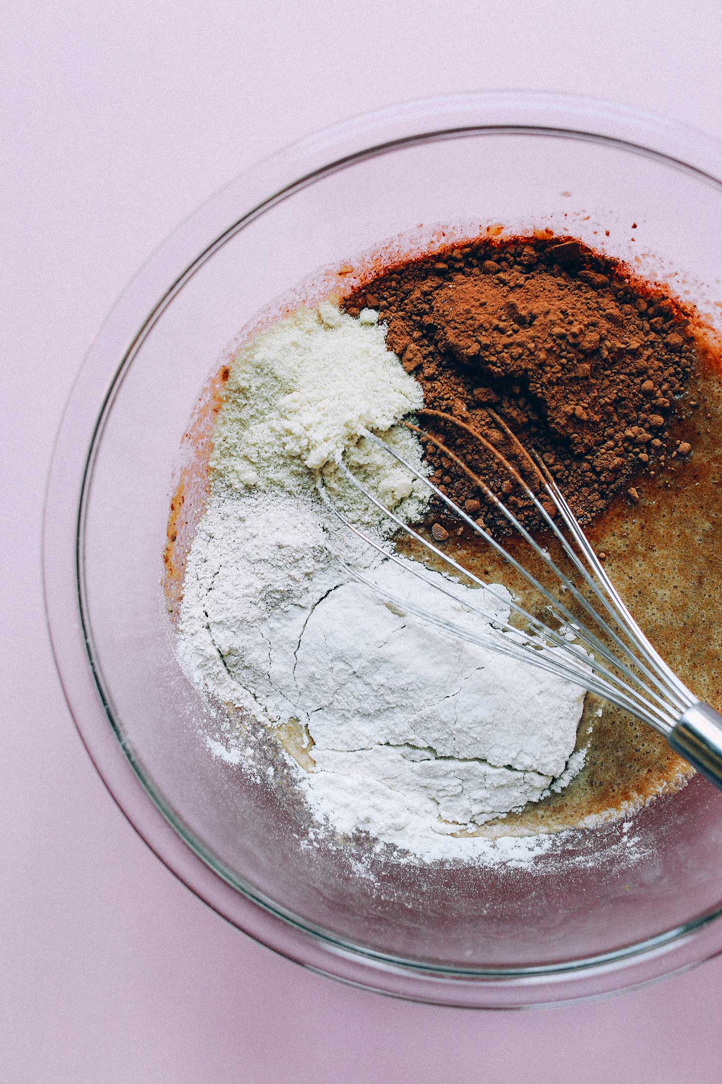 Whisking together ingredients for homemade gluten-free vegan Chocolate Muffins