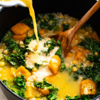 Pouring a miso and water mixture into a pot of soup