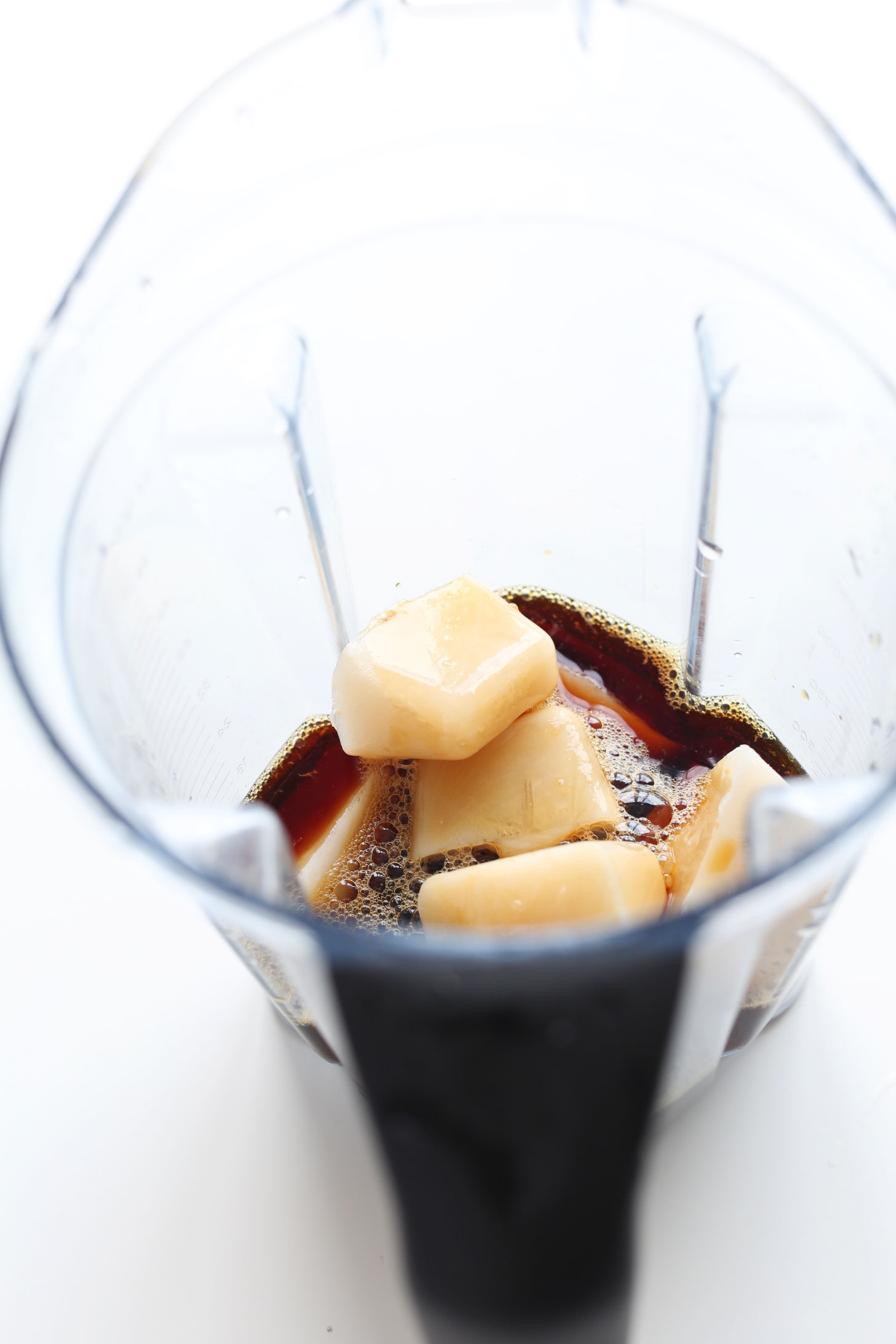 Blender with ingredients for making a healthy homemade Caramel Frappuccino