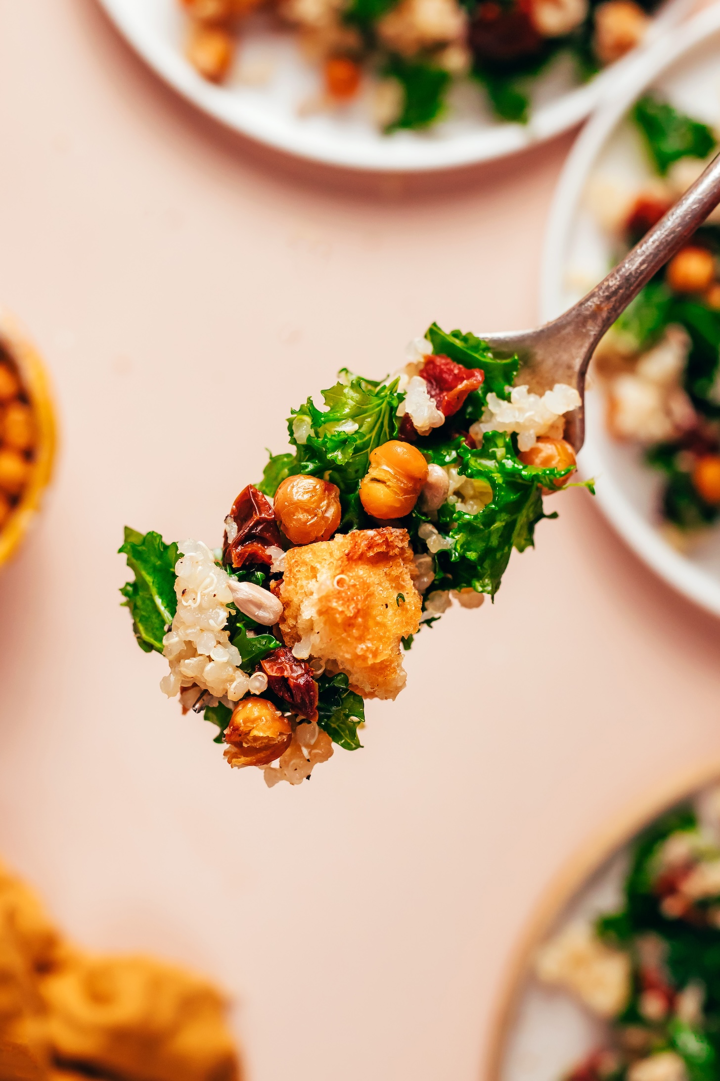Fork with a bite of Lemony Quinoa Kale Salad with Crispy Chickpeas