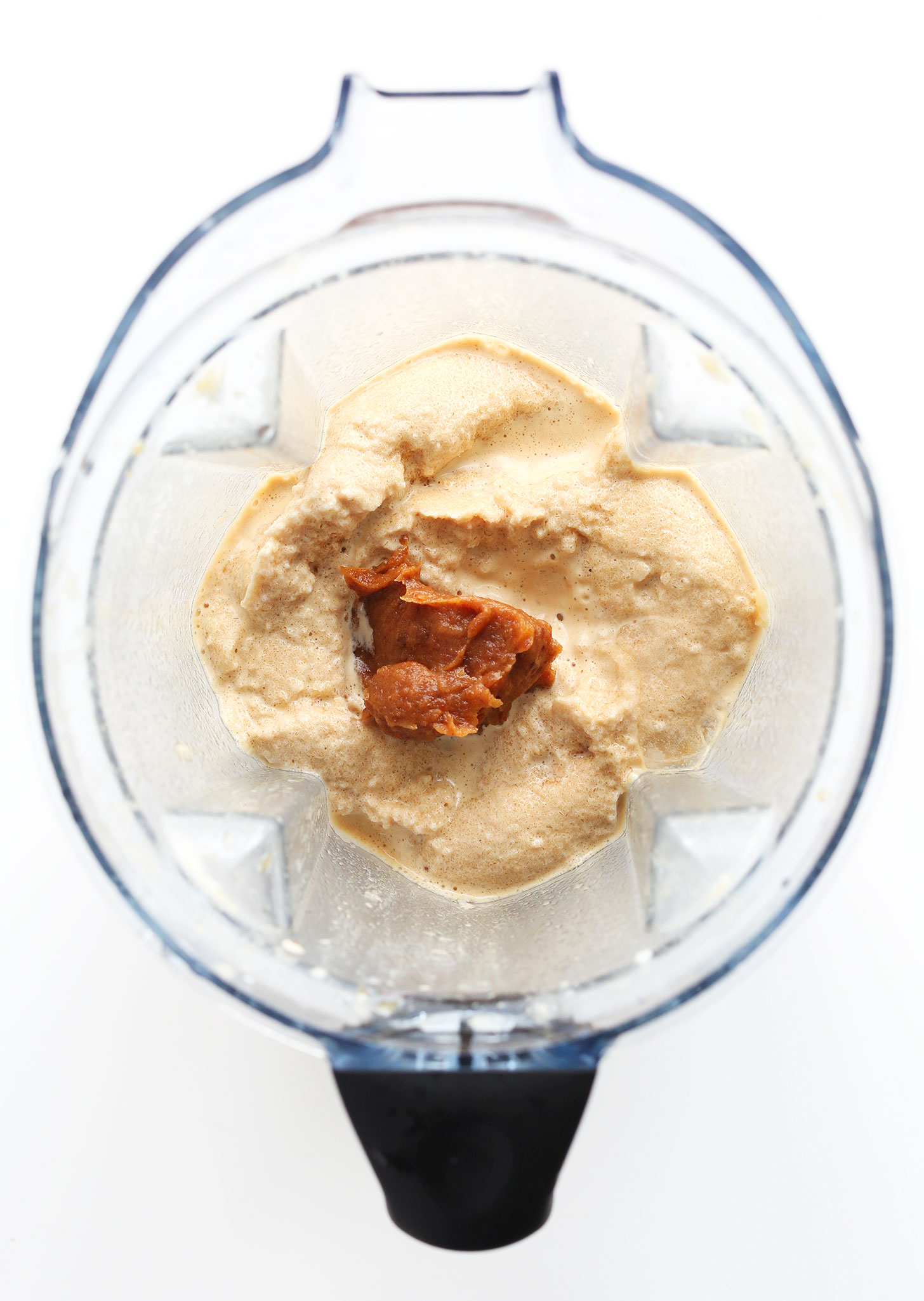 Adding date caramel to the blender for our homemade vegan Caramel Frappuccino recipe