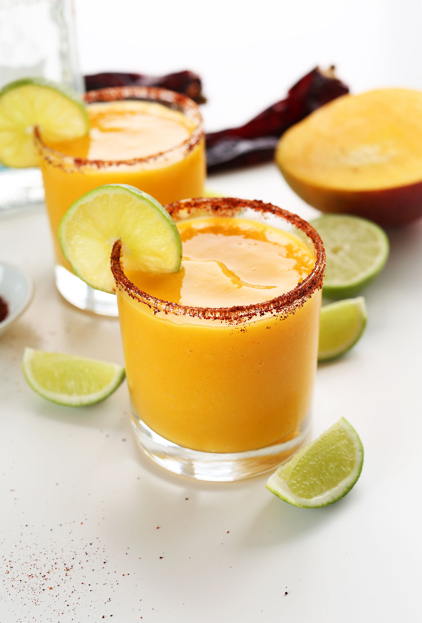 Glasses of our Easy Mango Chili Lime Margaritas recipe for a delicious summer drink