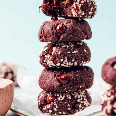 Plate with a tall stack of vegan gluten-free chocolate tahini cookies