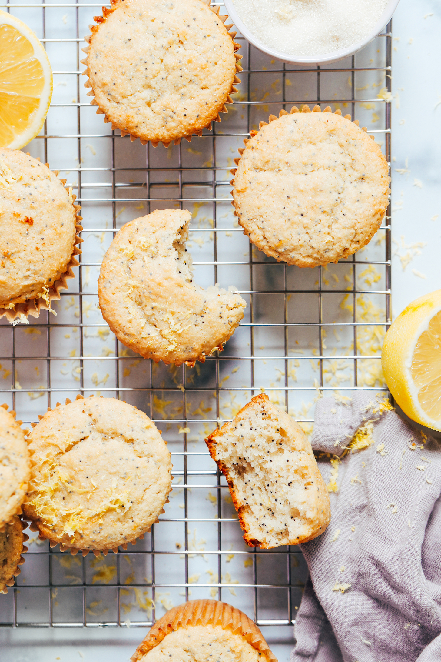 Vegan gluten-free lemon poppyseed muffins on a cooling rack