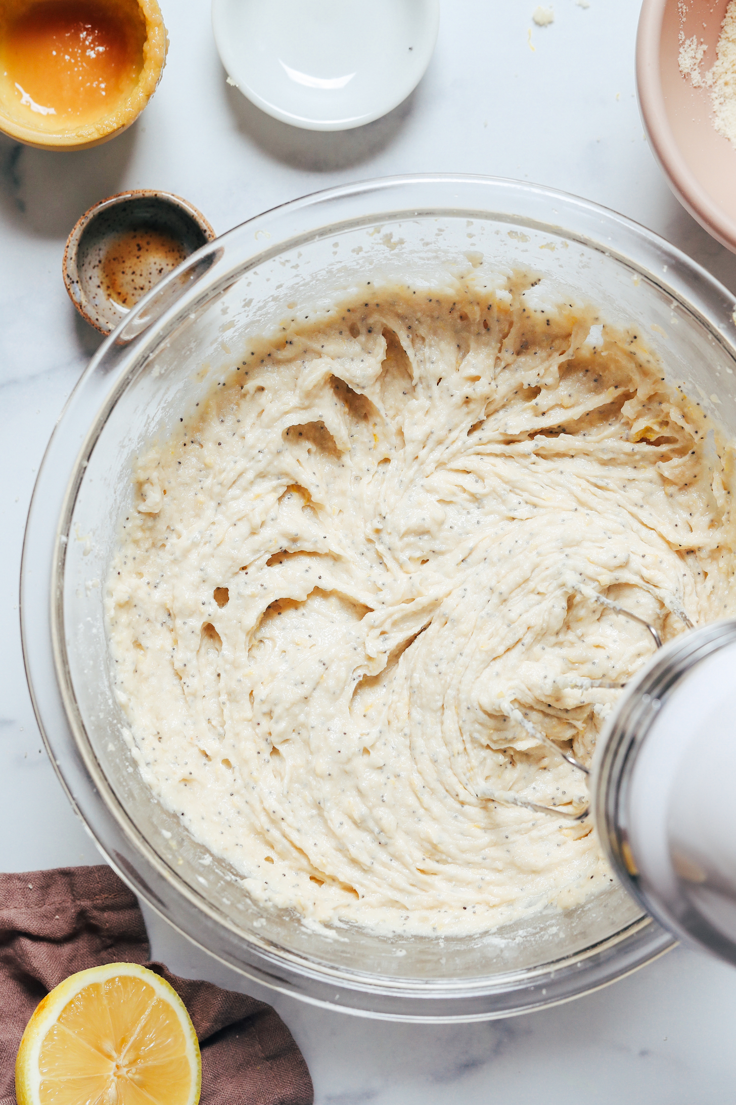 Using a hand mixer to whip the batter