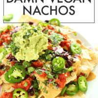 Plate of vegan nachos with guacamole on top