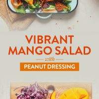 Cutting board of ingredients and tray filled with our Vibrant Mango Salad recipe