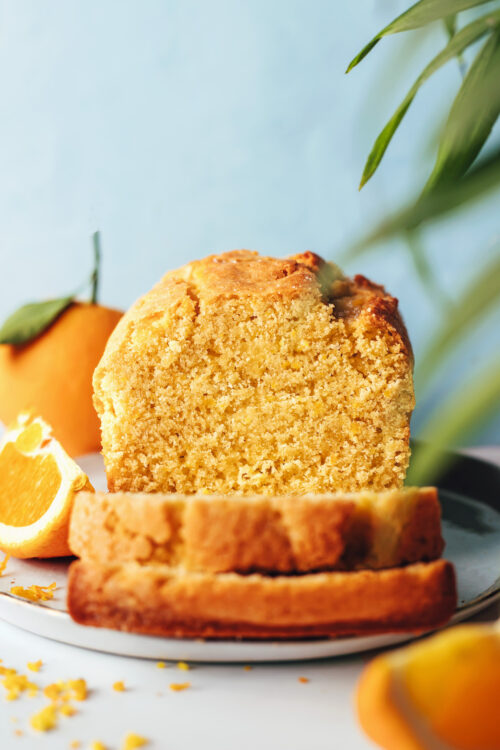 Partially sliced loaf of gluten-free orange almond cake