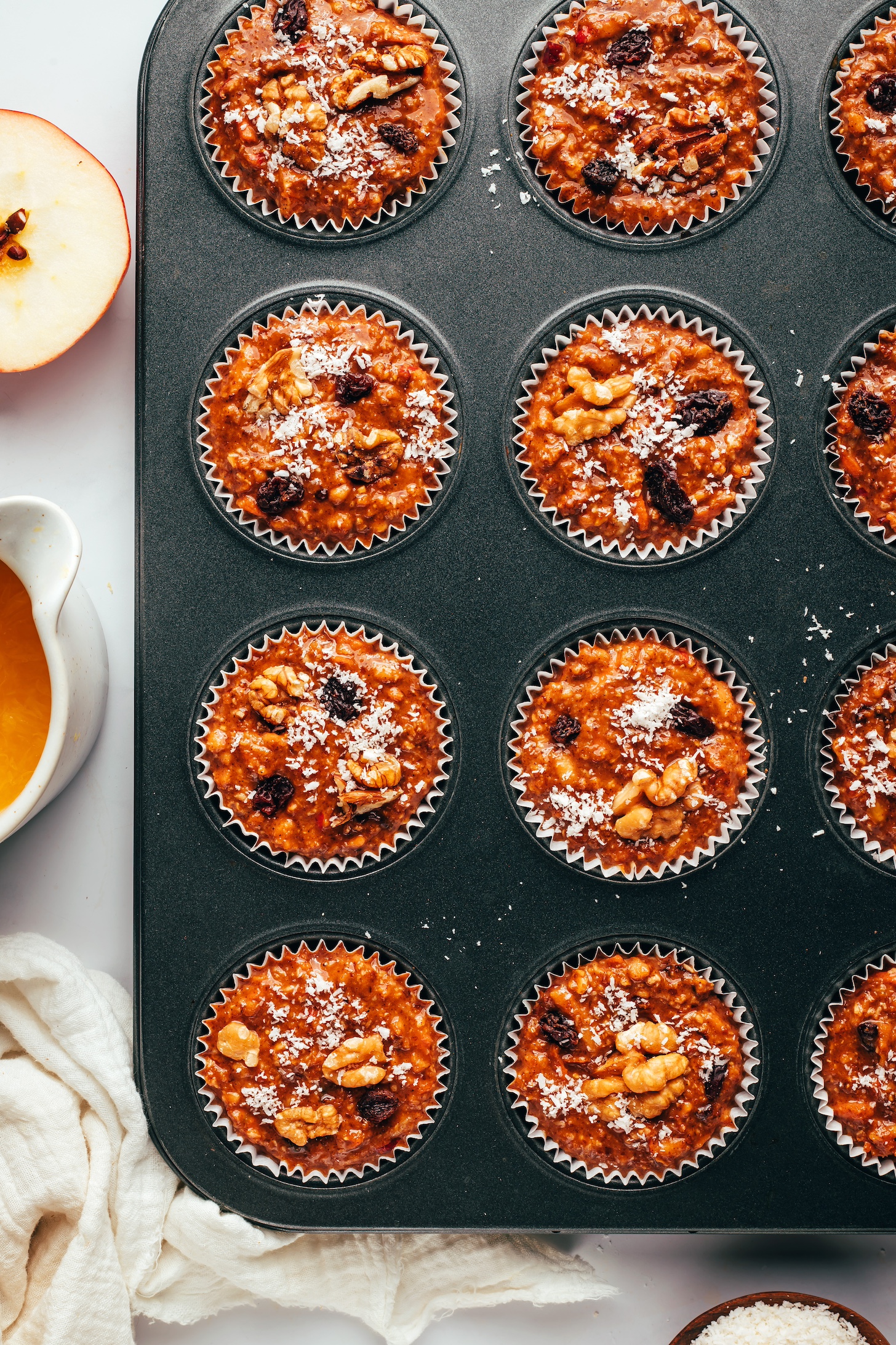 Muffin tin with vegan gluten-free morning glory muffins before baking